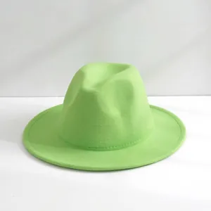 Close-up view of a stylish lime green wool fedora hat with a classic jazz crown design.