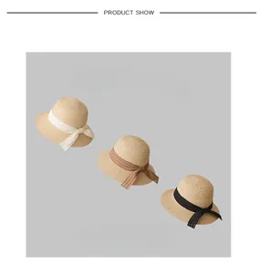 Collection of French vintage straw hats with colorful ribbon bows for sun protection.