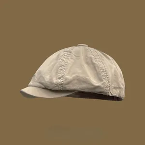 Classic British vintage newsboy cap in beige with octagonal design for unisex wear.