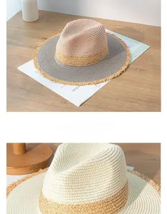 Detailed macro view showing the fine weave and frayed edge of a color-block straw sun hat