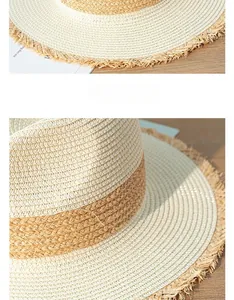 Close-up detail of a retro color-block straw hat with stylish frayed edges on brim