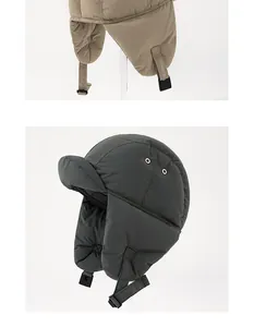 Detail van warme winter trappermuts met oorflappen en winddicht gewatteerd materiaal.