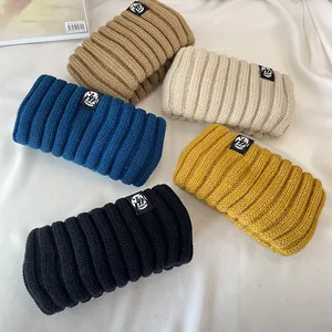 Set of five vintage thick knitted headbands in khaki, blue, yellow, black and white