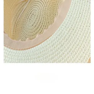 Detail view of breathable straw weave and comfortable inner sweatband of a sun hat