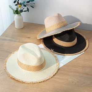 Collection of vintage patchwork straw hats with fringed edges for summer sun protection