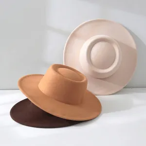 Close-up of three wool felt fedora hats in cream, camel and brown autumn colors