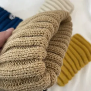 Close-up detail of vintage thick knitted headband showing warm elastic fabric texture