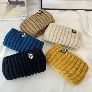 A diverse collection of vintage wide elastic knitted winter headbands in five colors