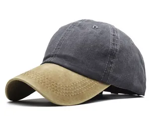 Vista detallada de una gorra de béisbol de algodón lavado con diseño bicolor en gris y caqui envejecido