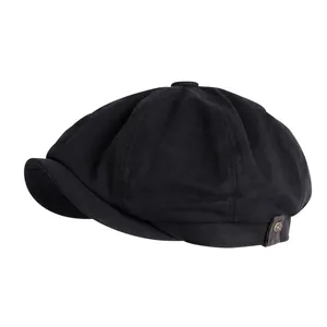 Classic black vintage newsboy cap with octagonal structure and side button detail