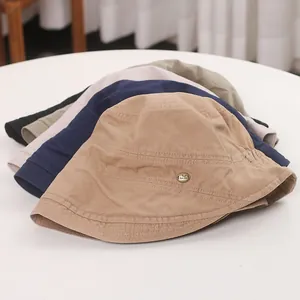 Close-up detail of various colored vintage Japanese pleated bucket hats for women