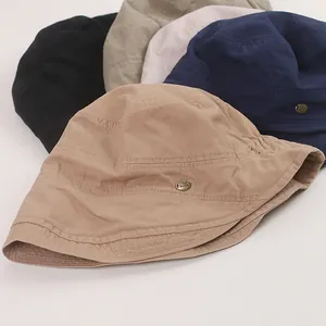 Detailed view showing the texture and colors of various vintage cotton bucket hats.