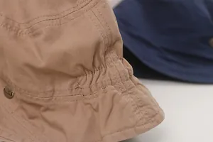 Close-up of the pleated texture and fine stitching on a Japanese style khaki bucket hat