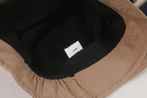 Detail view of the 100% cotton inner lining and sweatband of a retro bucket hat.