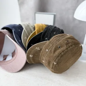 A variety of distressed military flat caps in multiple colors for stylish sun protection.