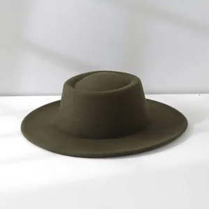 Close-up detail of a vintage olive green woolen fedora hat for women with round top