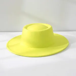Close-up detail of a bright yellow vintage wool felt boater hat with a unique dome top