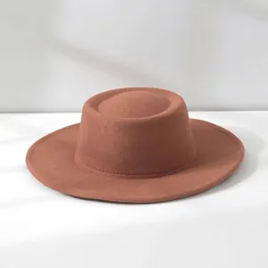 Detailed view of a vintage brown wool felt fedora featuring a classic flat top design