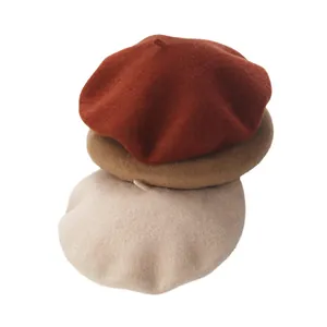 Vintage wool beret hats for women in rust, camel, and beige winter earth tones