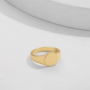 Minimalist elegant gold-plated alloy signet ring featuring a smooth circular top