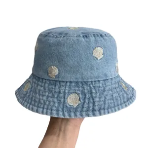 Kids light blue denim bucket hat featuring embroidered shell patterns for sun protection