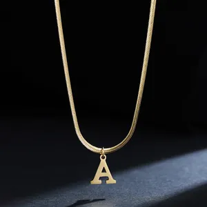 Detail of gold-plated stainless steel necklace with 'A' initial pendant and snake chain