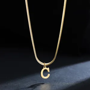 Detail of 18K gold plated stainless steel necklace featuring a letter C pendant