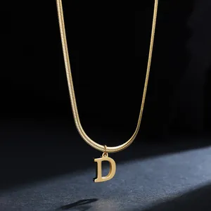 Macro detail of high-quality gold plated stainless steel necklace with letter D pendant