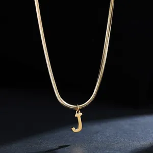 Close-up of a delicate 18K gold plated stainless steel necklace with a letter J pendant.