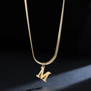 Detailed view of 18K gold plated stainless steel letter M pendant on snake chain