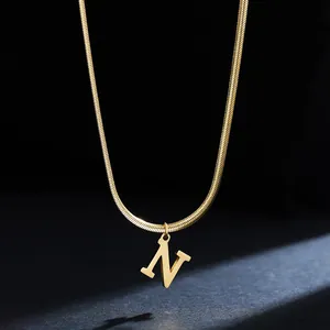Close-up detail of 18K gold plated stainless steel letter N initial pendant on a snake chain