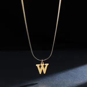 Detailed shot of a gold stainless steel necklace featuring a bold 'W' initial pendant.