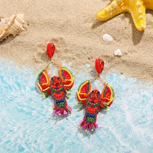 Detailed view of hand-woven lobster earrings featuring colorful seed beads and sequins