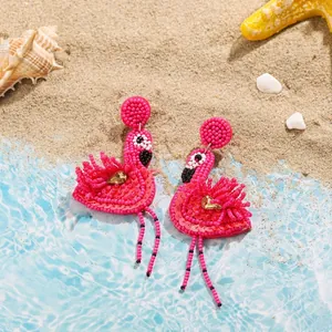 Detailed view of handmade pink beaded flamingo drop earrings featuring sparkling sequins