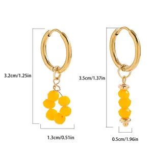 Detailed view of asymmetric gold hoop earrings with yellow bead charms and dimensions