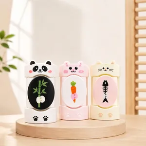 Set of three cute cartoon animal quilt clips displayed on a wooden stand in a warm room