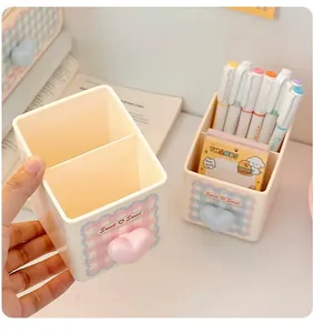 Close-up view of cute divided desk organizer with two storage compartments for pens