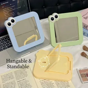 Lindo espejo de maquillaje cuadrado con ojos móviles y soporte plegable para escritorio