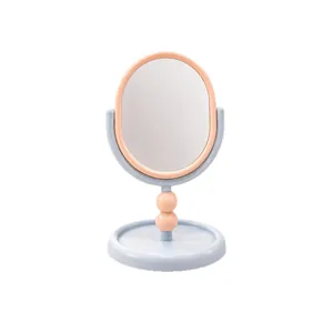 Miroir de maquillage de bureau rotatif à 360° avec cadre ovale et plateau socle