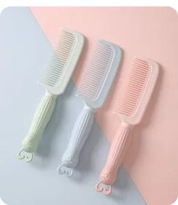 Three pastel-colored portable hair combs featuring cute rabbit ear handles in pink, green, and blue.