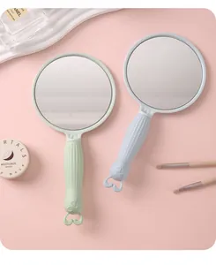 Cute rabbit-shaped handheld makeup mirrors in pastel green and blue for girls