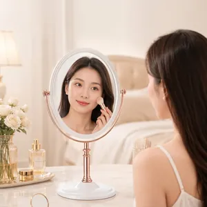 Vintage rose gold rotatable double-sided makeup mirror shown on a marble tabletop scene