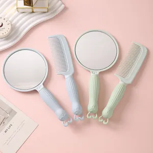 Portable handheld makeup mirror and comb set with cute bunny character design. Pink set.