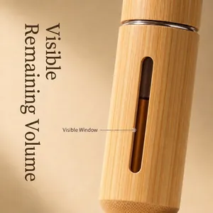 Vaporisateur de parfum luxe en bois de bambou avec une fenêtre de niveau visible
