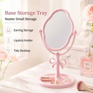 Eleganter rosa Schminkspiegel für den Schreibtisch mit Schleife und Schmuck-Organizer-Basis
