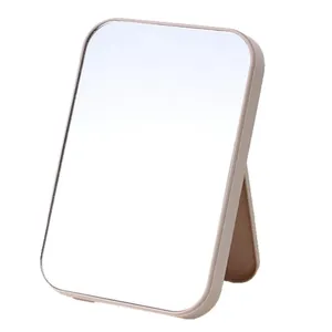 Minimalist foldable desktop makeup mirror with beige rectangular frame for vanity table