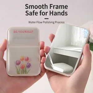 Portable folding makeup mirror featuring a cute tulip design and 'BE YOURSELF' slogan print