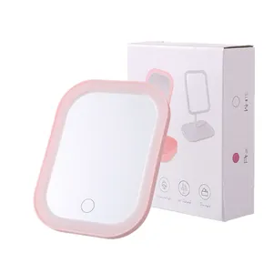Tragbarer LED-Schminkspiegel mit verstellbarem Licht und rosa Rahmen in der Box.