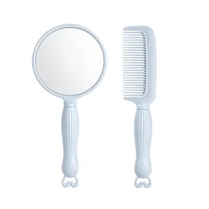 Portable pale blue handheld mirror and comb set with cute character handle design