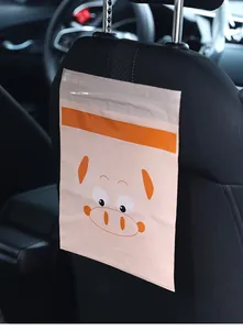 Macro detail of cute pig pattern disposable car trash bag stuck to car seat back